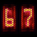 The Nixie tube indicator of the numbers of retro style. Indicator glow with a magical purple fringing. Digit 6,7 Royalty Free Stock Photo