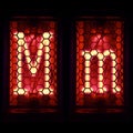 Nixie tube indicator set of letters the whole alphabet. The letter M Royalty Free Stock Photo