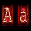 Nixie tube indicator set of letters the whole alphabet. The letter A . Royalty Free Stock Photo