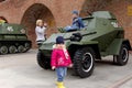 Nizhny Novgorod, Russia - May 3.2013. Children playing on the armored car BA-64 at exhibition of military equipment