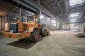 Nizhny Novgorod, Russia - October 30 2019. Plant KM PRECAST. Large construction machinery, tractor pouring sand