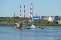 Nizhny Novgorod, Russia 08.07.2023 Oka River. Towing train on the river. A tug pulls a barge down the river. Caravan