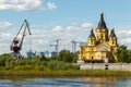 Nizhny Novgorod, Strelka. Alexander Nevsky Cathedral, port and construction cranes Royalty Free Stock Photo