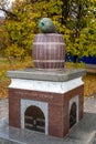 Nizhyn, Ukraine - October 17, 2021: Monument to Nizhyn Cucumber. Giant pickle of green italian granite on top of brown barrel