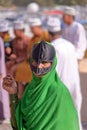 NIZWA, OMAN - FEBRUARY 3, 2012: Portrait of a bedouin Omani woman traditionally dressed attending the Goat Market