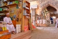 NIZWA, OMAN - FEBRUARY 2, 2012: The Souq in Nizwa Old Town with an Omani man traditionally dressed on the left