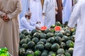 NIZWA, OMAN - NOVEMBER 18, 2022: Nizwa Goat Market. People selling watermelons.Traditional fruits and vegetables bazaar in Nizwa,