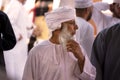 Old man in traditional Omani clothes in the Nizwa souq on Friday