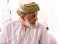 Old man in traditional Omani clothes in the Nizwa souq on Friday