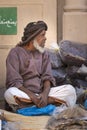 Old omani man selling dry fish at a market in Nizwa