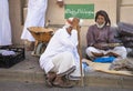 Old omani man selling dry fish at a market in Nizwa