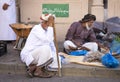 Old omani man selling dry fish at a market in Nizwa