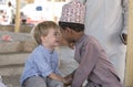 Omani boy making friends with european boy