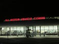 DMV. NJ Motor Vehicle Commission lighted sign with some letters not lighted at night in NJ. Ãâ.