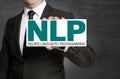 NLP sign is held by businessman