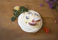 Anna Pavlova cake meringue with fruits and flowers