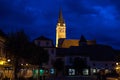 Saint Margaret Sf. Margareta church in the evening seen from the main square of Medias, one of the main cities of Transylvania