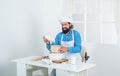 No added chemicals. skilled baker use kitchen utensils for cooking. male chef in hat prepare healthy meal. handsome man Royalty Free Stock Photo