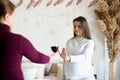 No alcohol during pregnancy. Young pregnant woman refuses to drink wine.