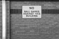 No ball game sign seen attached to the outside of a wall at an education center Royalty Free Stock Photo