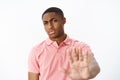 No bro thanks. Serious-looking displeased strict african american masculine guy pulling hand forward in stop and