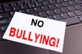 No Bullying writing text made in the office close-up on laptop computer keyboard. Business concept for Bullies Prevention Against