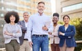 No challenge is too big for my team. a diverse group of businesspeople standing together on the balcony outside. Royalty Free Stock Photo