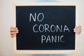 No corona panic. Coronavirus concept. Boy hold inscription on the board Royalty Free Stock Photo