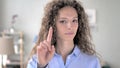 No, Curly Hair Woman Rejecting Offer by Waving Finger