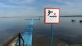 No Diving sign at beach, lake Naroch, Belarus. Warning sign of shallow water. Warning notice sign do not jump in water. Royalty Free Stock Photo