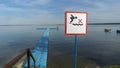 No Diving sign at beach, lake Naroch, Belarus. Warning sign of shallow water. Warning notice sign do not jump in water.