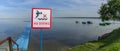 No Diving sign at beach, lake Naroch, Belarus. Warning sign of shallow water. Warning notice sign do not jump in water Royalty Free Stock Photo