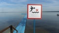 No Diving sign at beach, lake Naroch, Belarus. Warning sign of shallow water. Warning notice sign do not jump in water. Royalty Free Stock Photo