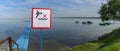 No Diving sign at beach, lake Naroch, Belarus. Warning sign of shallow water. Warning notice sign do not jump in water Royalty Free Stock Photo