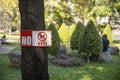 No Dog forbidden sign in the garden. Dogs are not allowed into the park Royalty Free Stock Photo