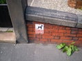 No dog fouling sign on side of house