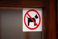 No dogs allowed sticker on wooden doorframe Royalty Free Stock Photo