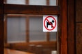 No dogs allowed sticker on wooden doorframe Royalty Free Stock Photo