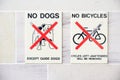 No dogs or bicycles allowed sign at entrance to building Royalty Free Stock Photo