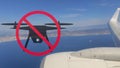 No drone flying warning sign and blurred view from the window of an airplane