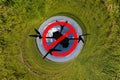 No drone zone sign concept for banning the use of drones in airspace. drone silhouette in red circle with crossed out stripe on