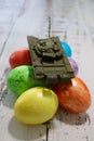 No easter for europe because of russia ukraine war conflict crisis toy tank on easter eggs