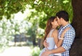 No else in the world right now.... A young couple kissing in the park. Royalty Free Stock Photo