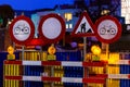 No entry, no bike entry, Under construction signs under illuminated evening lights