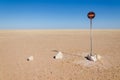 No entry or passage prohibited sign in the middle of the Namib Desert in front of blue sky Royalty Free Stock Photo