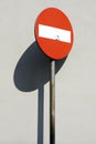 No entry red traffic sign with shadow on a grey concrete wall Royalty Free Stock Photo