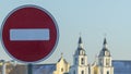 No Entry road sign on old orthodox church background. Winter. The road is closed red round sign.