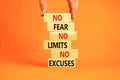 No fear limits excuses symbol. Concept words No fear no limits no excuses on wooden blocks. Beautiful orange background.