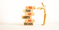 No fear limits excuses symbol. Concept words No fear no limits no excuses on wooden blocks. Beautiful white background.