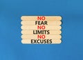 No fear limits excuses symbol. Concept words No fear no limits no excuses on wooden stick. Beautiful blue table blue background.